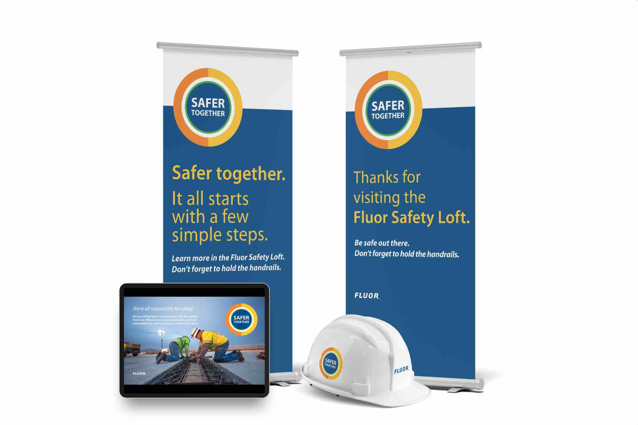 Fluor standing banners, tablet, and hard hat