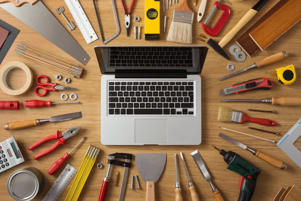 Tools laid out on a workbench surrounded by an AvreaFoster laptop.