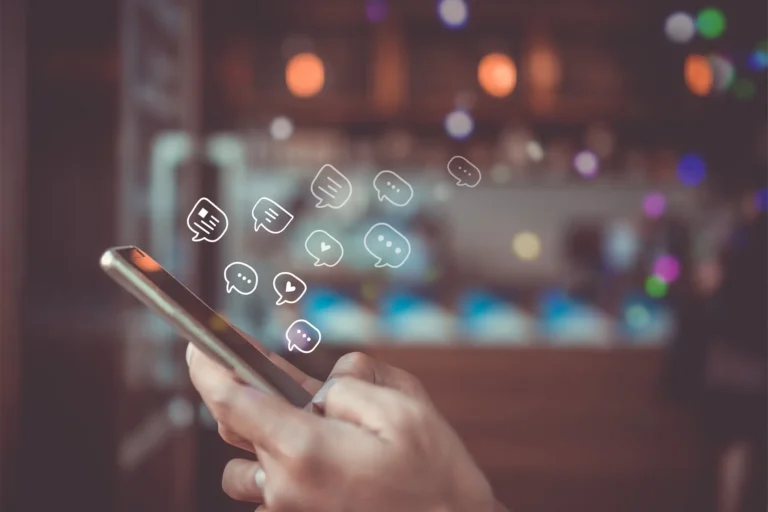 B2B marketer on a cell phone researching B2B digital content marketing strategies.